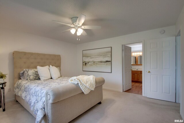 4804 Elm St, Quincy, IL 62305 - bedroom featuring light carpet, baseboards, ensuite bath, and a ceiling fan
