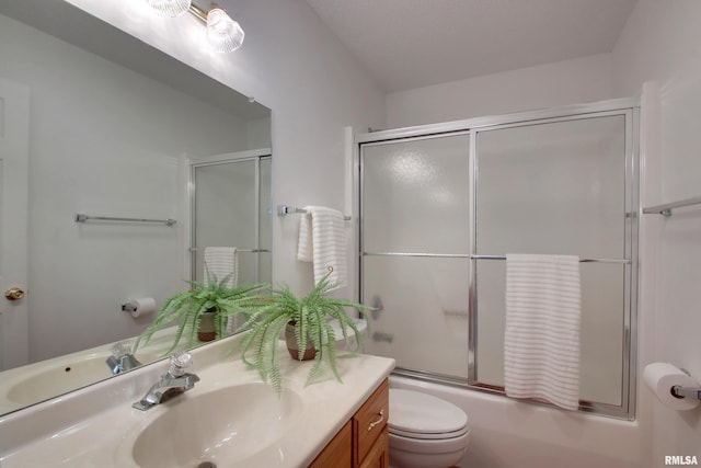 4804 Elm St, Quincy, IL 62305 - full bathroom with vanity, toilet, and shower / bath combination with glass door