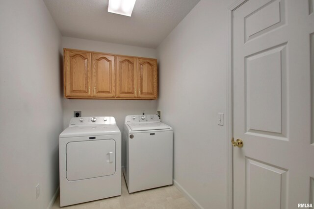 4804 Elm St, Quincy, IL 62305 - laundry room with cabinet space, washer and clothes dryer, and baseboards
