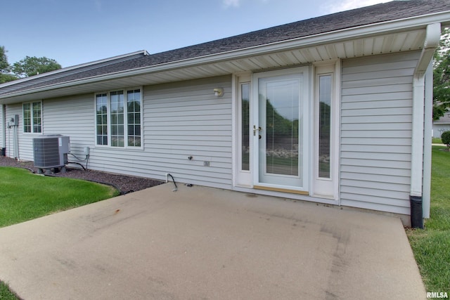 4804 Elm St, Quincy, IL 62305 - rear view of house featuring central AC, a patio area, and a shingled roof