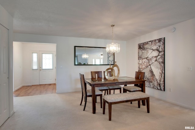 4804 Elm St, Quincy, IL 62305 - dining space with light colored carpet and a chandelier