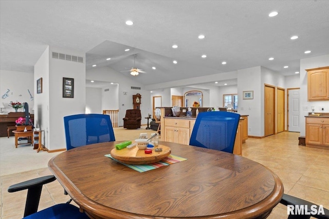 dining room with lofted ceiling, recessed lighting, baseboards, ceiling fan, and visible vents