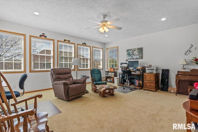 carpeted office with baseboards, a textured ceiling, recessed lighting, and a ceiling fan