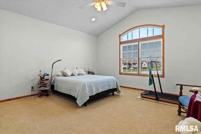 bedroom featuring carpet floors, baseboards, vaulted ceiling, and a textured ceiling