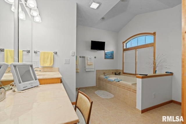 full bathroom with vaulted ceiling, vanity, a garden tub, tile patterned flooring, and baseboards