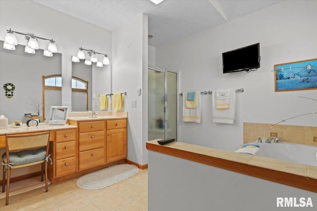 bathroom with vanity, a textured ceiling, a shower stall, and a bath