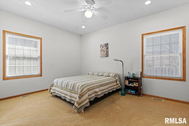 bedroom with carpet, baseboards, and visible vents
