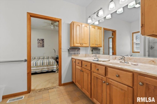 full bath featuring double vanity, visible vents, a sink, and a ceiling fan