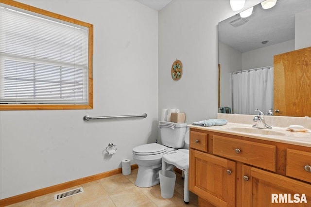 full bath featuring visible vents, baseboards, toilet, vanity, and tile patterned flooring