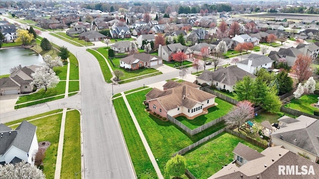 bird's eye view with a residential view and a water view