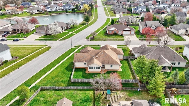 bird's eye view with a residential view and a water view