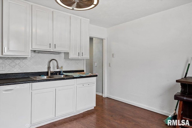 kitchen with a sink, dark countertops, decorative backsplash, and dishwasher