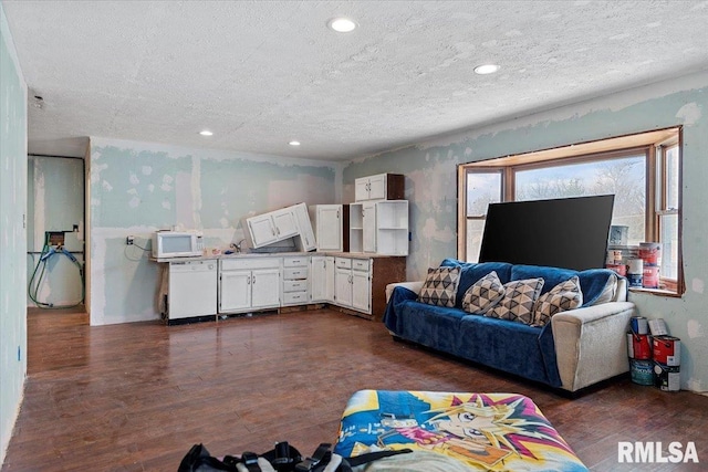 living area with a textured ceiling, recessed lighting, and dark wood-style flooring