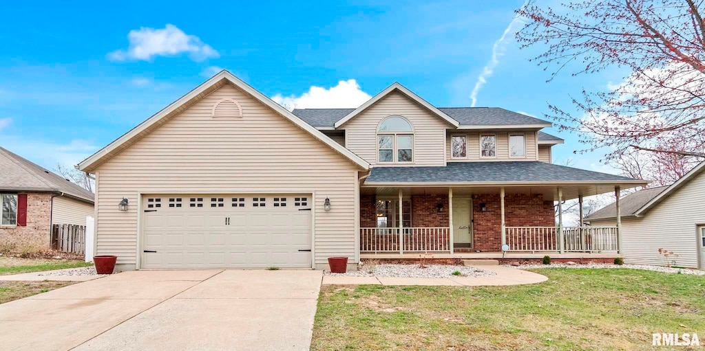 traditional-style house with driveway, a front yard, brick siding, a garage, and covered porch
