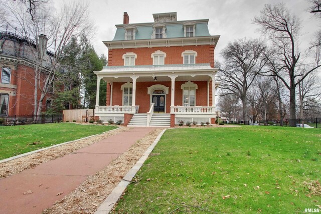1477 Maine St, Quincy, IL 62301 - view of front of property with covered porch, mansard roof, fence, and a front lawn