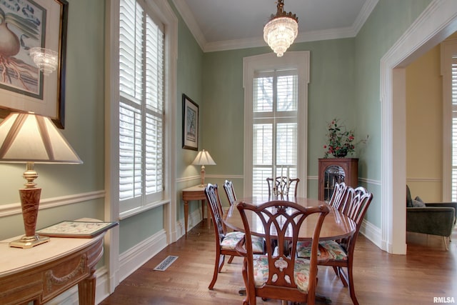 1477 Maine St, Quincy, IL 62301 - dining room featuring plenty of natural light, visible vents, a chandelier, and dark wood finished floors