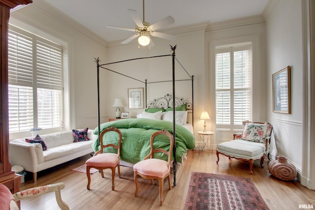 1477 Maine St, Quincy, IL 62301 - bedroom featuring ornamental molding, multiple windows, and wood finished floors