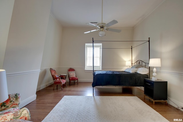 1477 Maine St, Quincy, IL 62301 - bedroom featuring baseboards, crown molding, wood finished floors, and ceiling fan