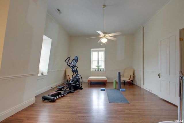 1477 Maine St, Quincy, IL 62301 - workout area featuring wood finished floors, baseboards, visible vents, ceiling fan, and ornamental molding