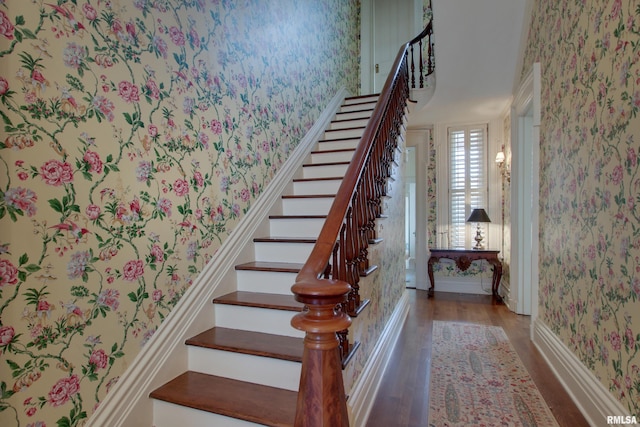 1477 Maine St, Quincy, IL 62301 - staircase featuring wallpapered walls, baseboards, and wood finished floors