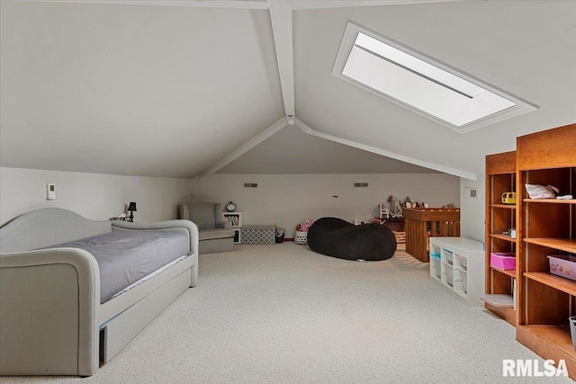 bedroom featuring carpet floors and vaulted ceiling with skylight