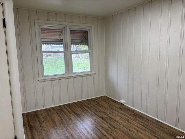 empty room featuring dark wood-type flooring