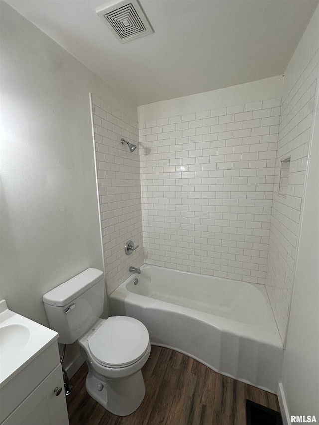 full bathroom featuring shower / tub combination, visible vents, toilet, and wood finished floors