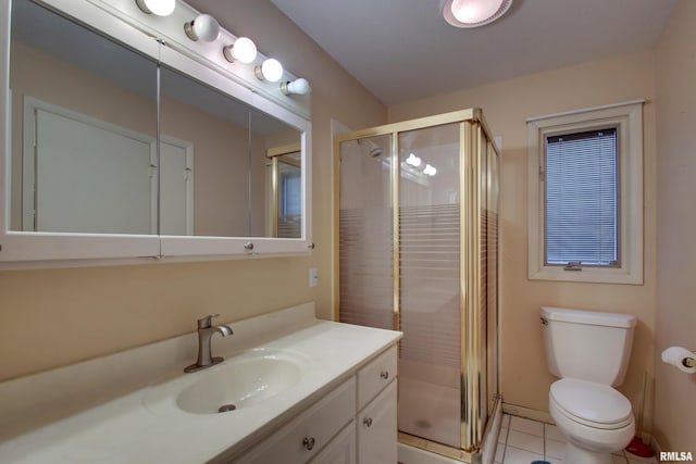 624 Pawn Ave, Quincy, IL 62305 - bathroom with tile patterned floors, toilet, a stall shower, and vanity