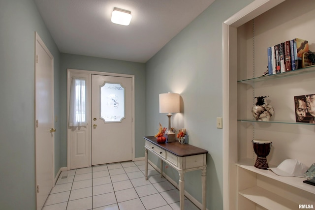 624 Pawn Ave, Quincy, IL 62305 - foyer with baseboards and light tile patterned flooring