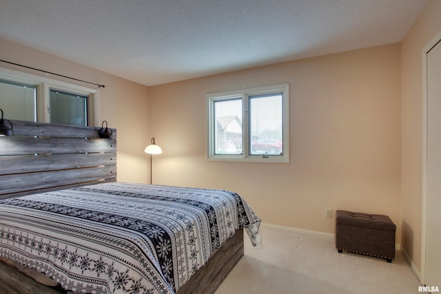 624 Pawn Ave, Quincy, IL 62305 - carpeted bedroom with baseboards and a textured ceiling