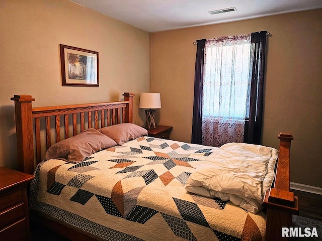 bedroom featuring visible vents