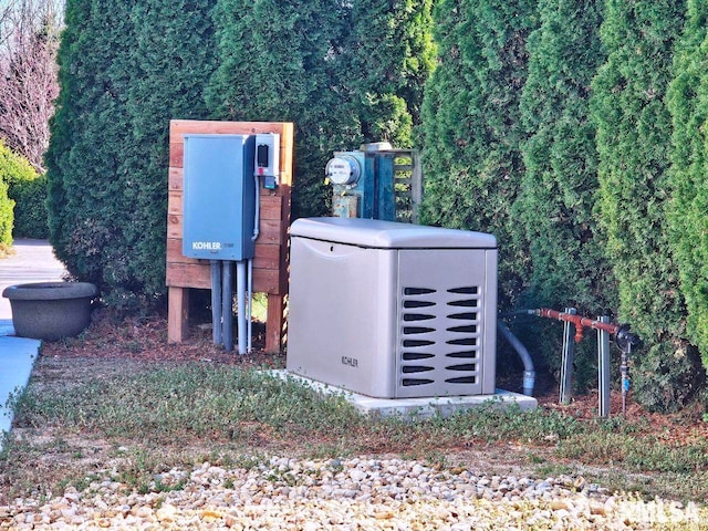 details featuring electric meter and a power unit