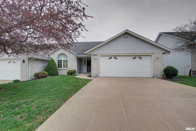 812 N 49th St, Quincy, IL 62305 - ranch-style home featuring a garage, a front yard, concrete driveway, and brick siding