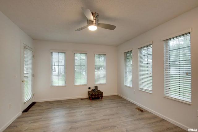 812 N 49th St, Quincy, IL 62305 - unfurnished room featuring light wood finished floors, visible vents, baseboards, and ceiling fan