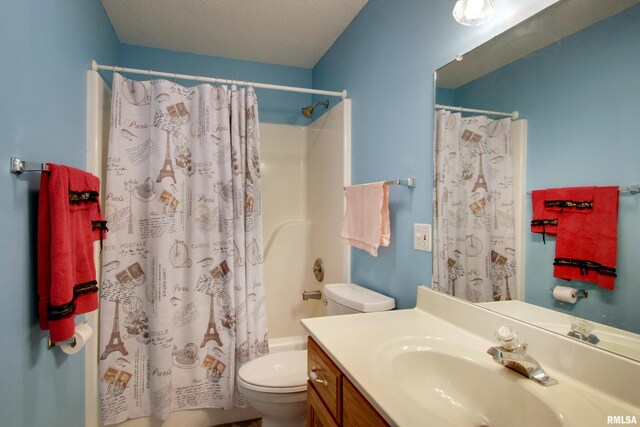 812 N 49th St, Quincy, IL 62305 - full bathroom with toilet, vanity, and a textured ceiling