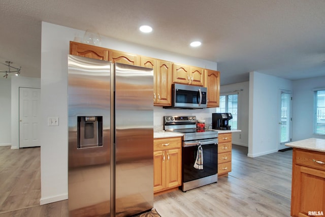 812 N 49th St, Quincy, IL 62305 - kitchen with light wood finished floors, baseboards, recessed lighting, and stainless steel appliances