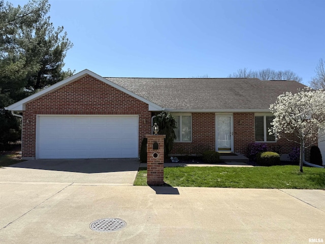 104 W Waterford Dr, Quincy, IL 62305 - ranch-style home featuring brick siding, a shingled roof, a garage, and concrete driveway