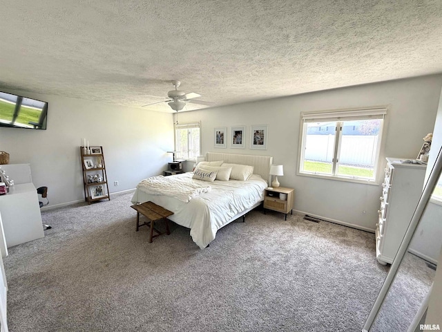 104 W Waterford Dr, Quincy, IL 62305 - carpeted bedroom with a textured ceiling, baseboards, and a ceiling fan