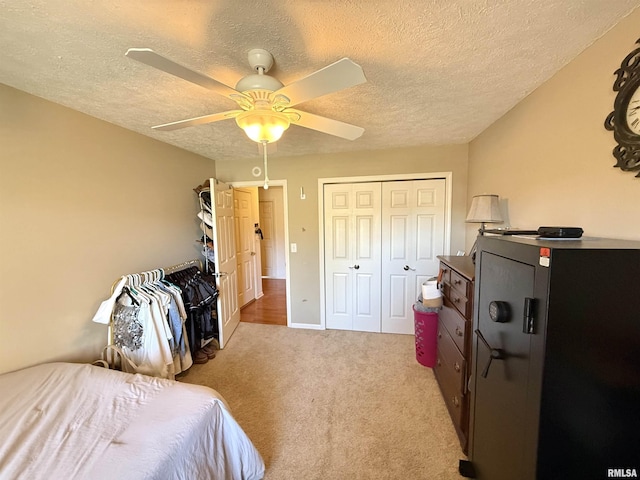 104 W Waterford Dr, Quincy, IL 62305 - bedroom with a textured ceiling, a closet, a ceiling fan, and carpet floors
