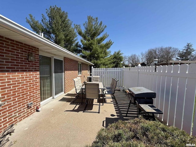 104 W Waterford Dr, Quincy, IL 62305 - view of patio with outdoor dining space and fence