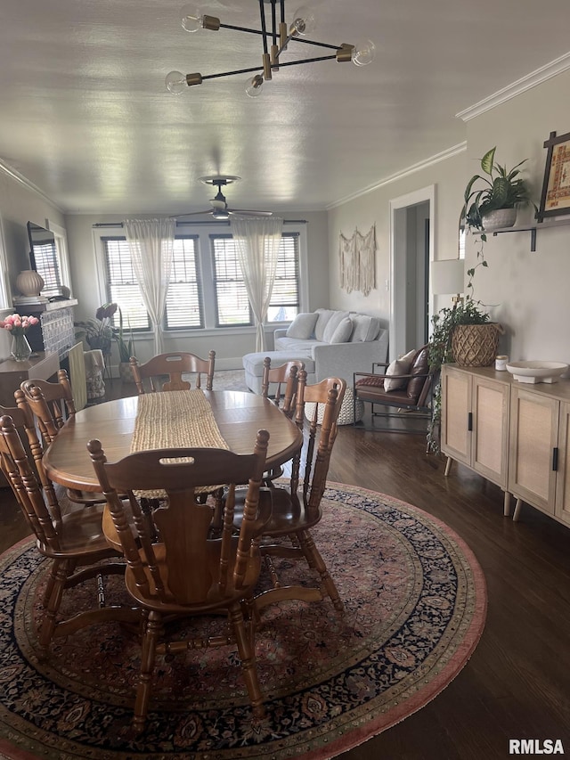 1037 Brown Ave, Galesburg, IL 61401 - dining room featuring dark wood-type flooring, a chandelier, and ornamental molding