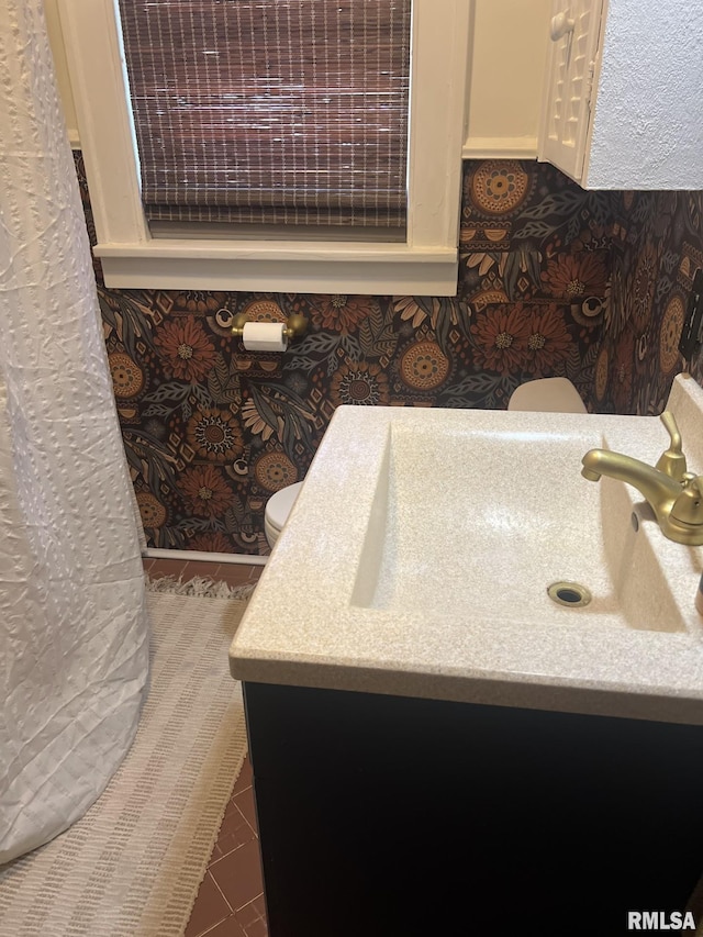 1037 Brown Ave, Galesburg, IL 61401 - bathroom featuring toilet, tile patterned floors, and vanity