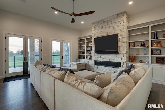 2300 Greenspointe Cir, Quincy, IL 62301 - living room with french doors, a ceiling fan, recessed lighting, dark wood-type flooring, and a fireplace