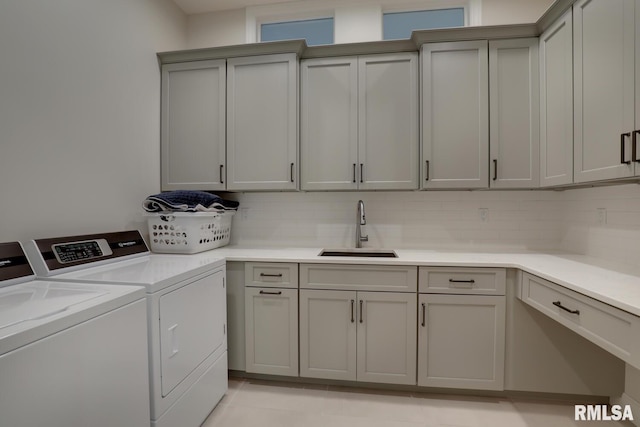 2300 Greenspointe Cir, Quincy, IL 62301 - laundry area with cabinet space and washer and clothes dryer
