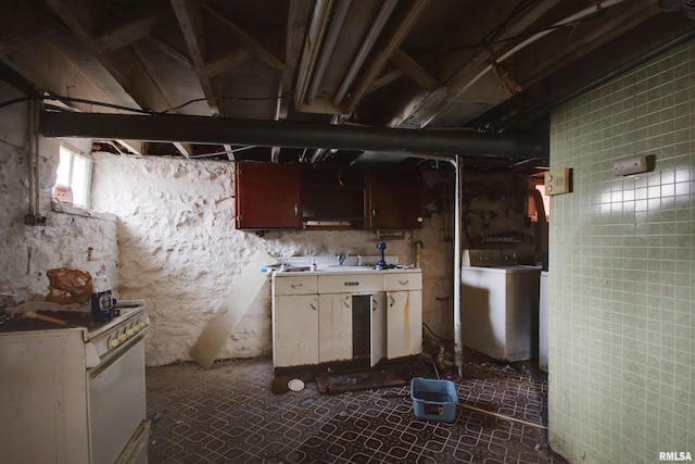 304 Chestnut St, Quincy, IL 62301 - kitchen featuring washer / clothes dryer, light countertops, and white range