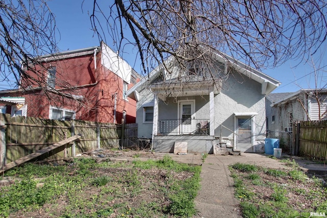304 Chestnut St, Quincy, IL 62301 - back of house featuring central AC, a porch, fence private yard, and stucco siding