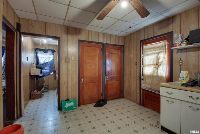 304 Chestnut St, Quincy, IL 62301 - interior space featuring wooden walls, ceiling fan, and light floors