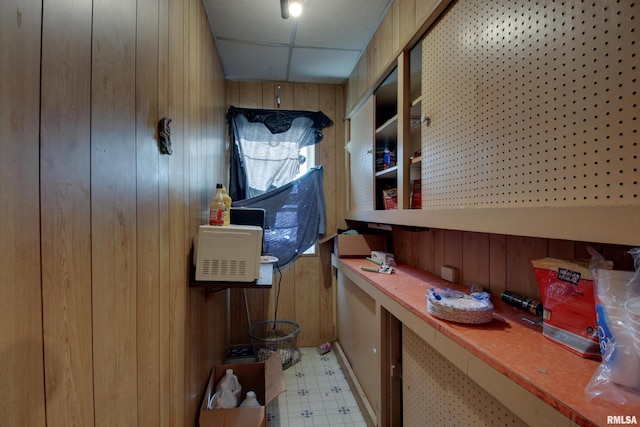 304 Chestnut St, Quincy, IL 62301 - kitchen featuring wood walls, a paneled ceiling, and light floors