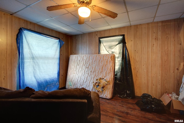 304 Chestnut St, Quincy, IL 62301 - living area with wooden walls, a drop ceiling, and wood finished floors