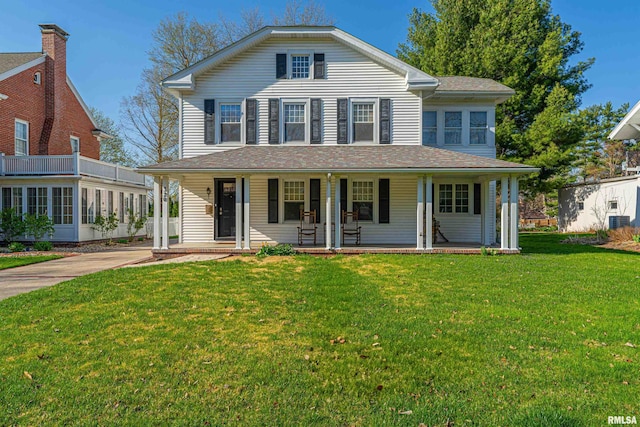 view of front of home with a porch, a shingled roof, cooling unit, and a front lawn